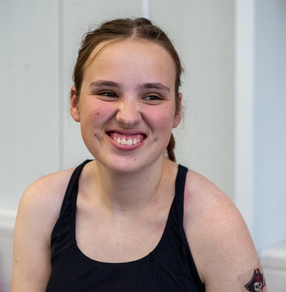 Lily Kahrl, who has a rare genetic disorder, STXBP1 encephalopathy, competed last winter for the Wellesely High School swimming and diving team.
