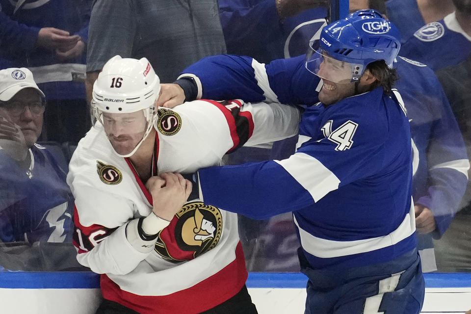 Tampa Bay Lightning left wing Pat Maroon (14) and Ottawa Senators left wing Austin Watson (16) fight during the first period of an NHL hockey game Tuesday, Nov. 1, 2022, in Tampa, Fla. (AP Photo/Chris O'Meara)