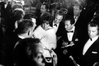 Elizabeth Taylor walks through a crowd of admirers at the Oscars in 1961 — the year she won her first Academy Award, for her role in Butterfield 8. (Grey Villet—Time & Life Pictures/Getty Images) <br> <br> <a href="http://life.time.com/culture/oscars-classic-photos-from-hollywoods-biggest-night/#1" rel="nofollow noopener" target="_blank" data-ylk="slk:Click here to see the full collection at LIFE.com;elm:context_link;itc:0;sec:content-canvas" class="link ">Click here to see the full collection at LIFE.com</a>