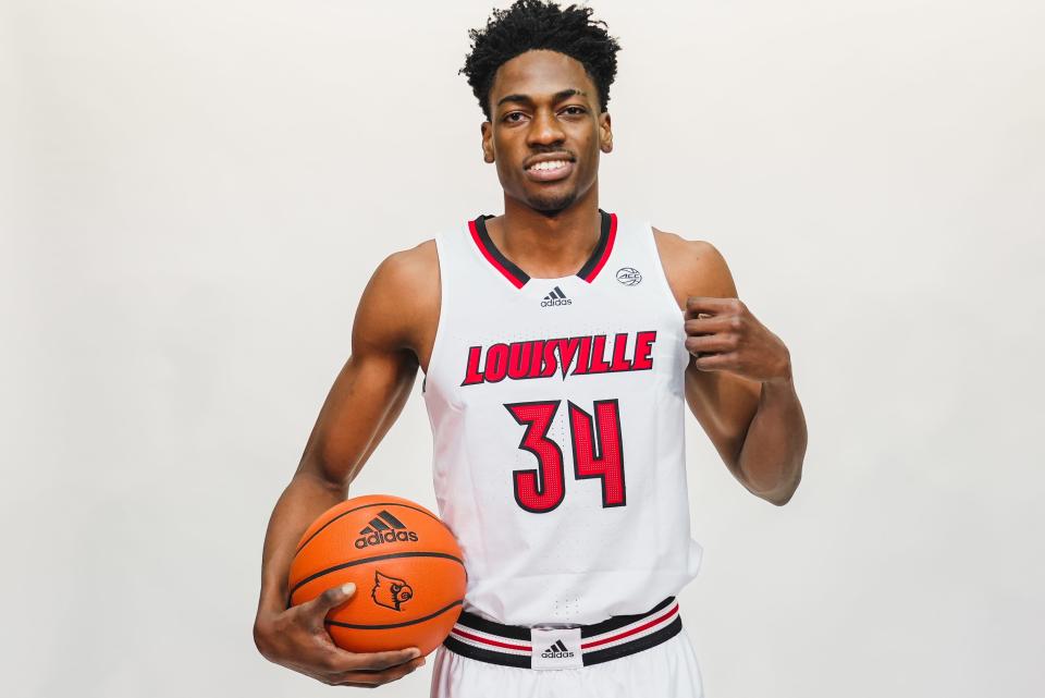 Emmanuel Okorafor poses for a picture in a Louisville men's basketball jersey. Okorafor, a 6-foot-9 forward/center from Lagos, Nigeria, joined the Cardinals from NBA Africa and will suit up for his first game Wednesday, Jan. 25, 2023, at Boston College.