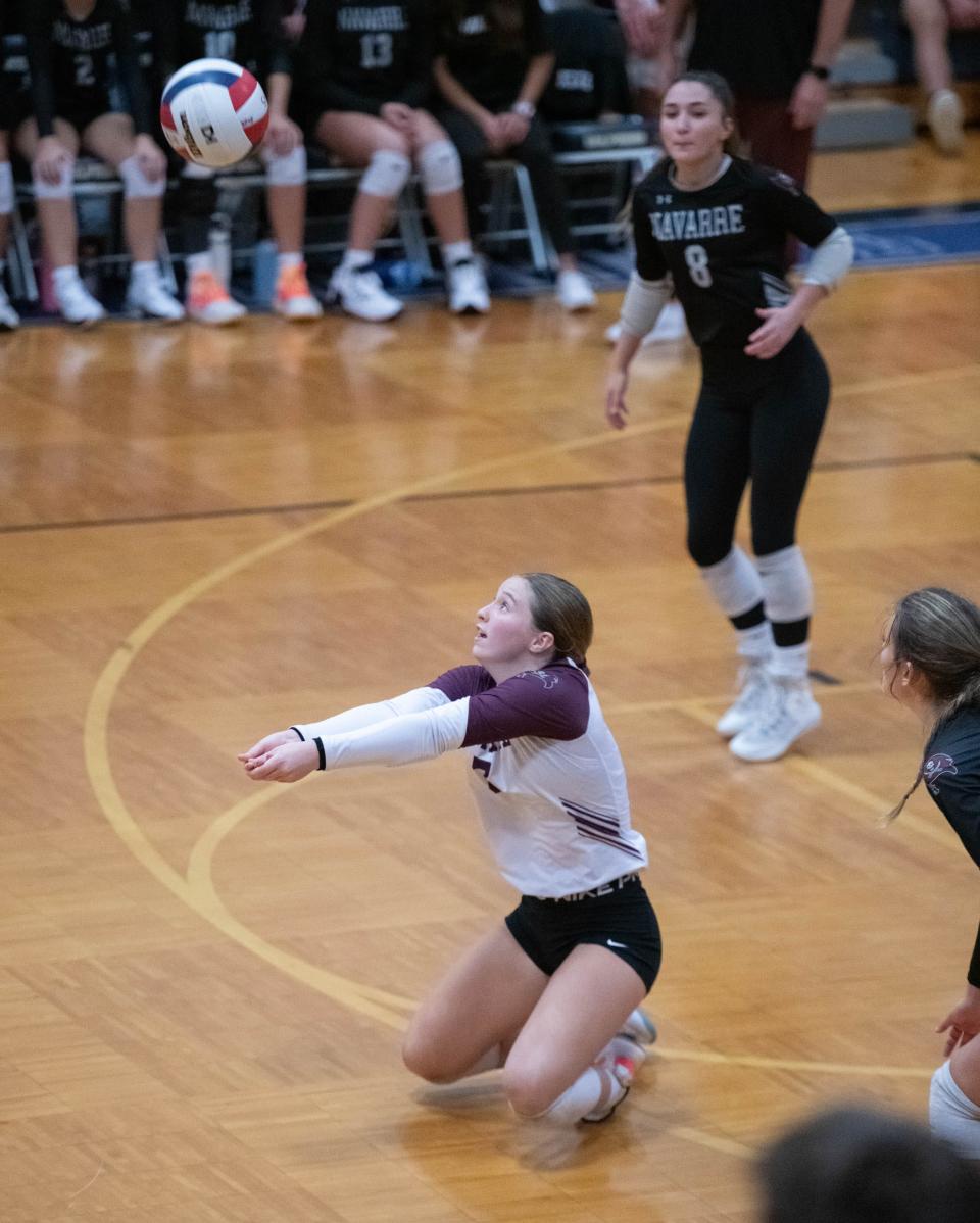 Addison Danforth (7) plays the ball during the Navarre vs Gulf Breeze volleyball match at Gulf Breeze High School on Thursday, Sept. 28, 2023.