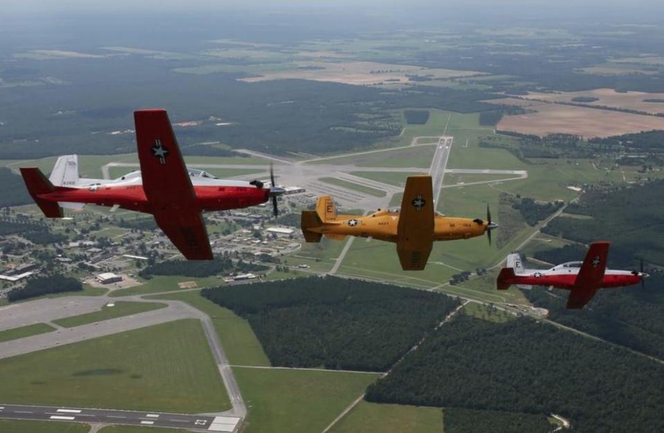 A formation of T-6B Texan II aircraft approach Naval Air Station Whiting Field after the aircraft was assigned as a trainer for the installation. In late 2020, a crash of a T-6B Texan II from NAS Whiting Field claimed the lives of both aviators on board.