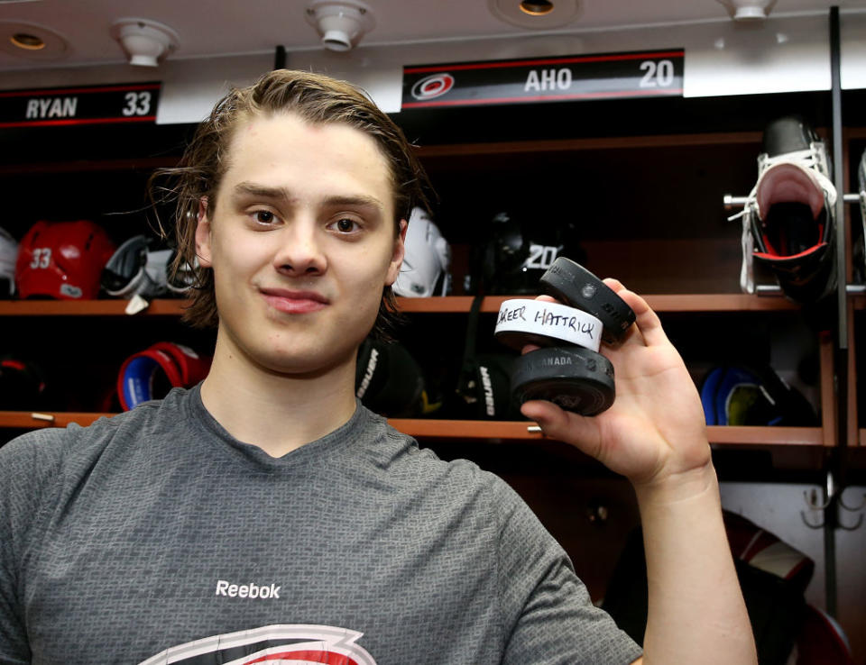 RALEIGH, NC – JANUARY 31: Sebastian Aho #20 of the Carolina Hurricanes poses with three pucks celebrating his first career hat trick following an NHL game against the Philadelphia Flyers on January 31, 2017 at PNC Arena in Raleigh, North Carolina. (Photo by Gregg Forwerck/NHLI via Getty Images)