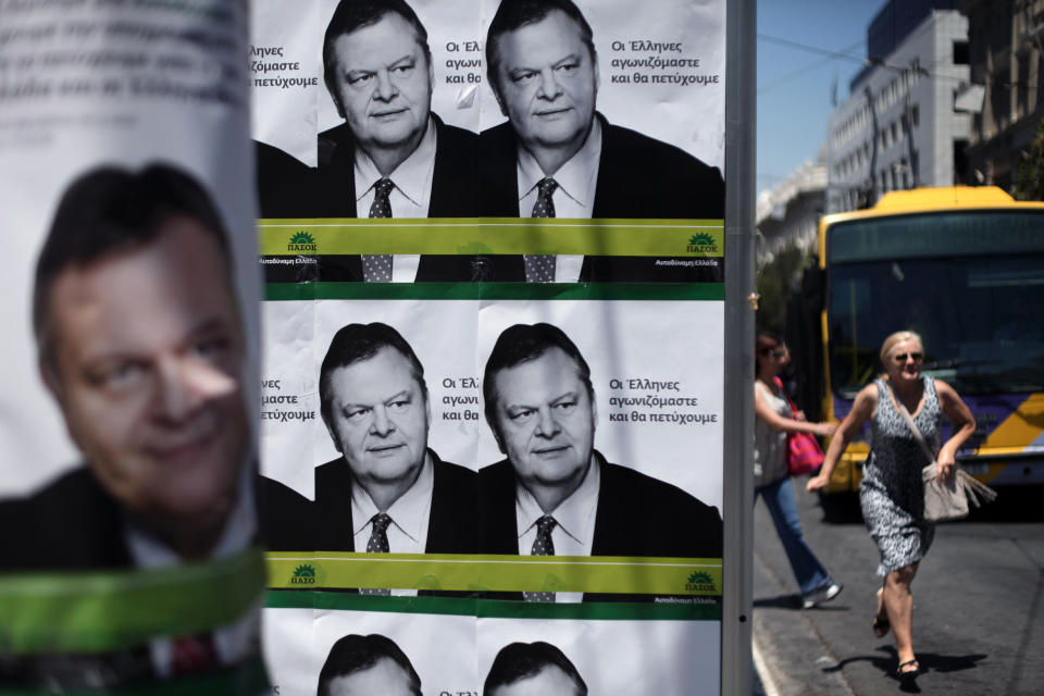 Electoral posters of Greek socialist party leader Evangelos Venizelos that read "We Greeks are fighting and we will succeed," are seen in central Athens, Tuesday, June, 12, 2012. Greece holds crucial national elections on Sunday, June 17, that could ultimately determine whether the deeply-indebted, recession bound country remains within the eurozone. The elections on May 6 resulted in a hung parliament. (AP Photo/Petros Giannakouris)