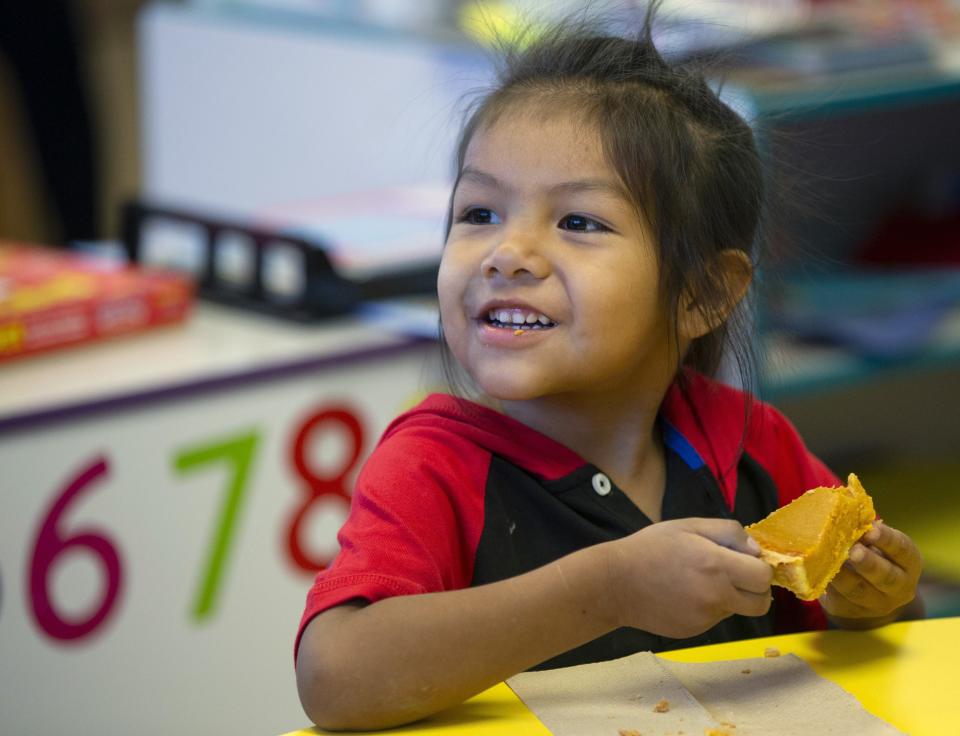 Michael Antone samples pumpkin pie during a pre-kindergarten program at Salt River Elementary School.