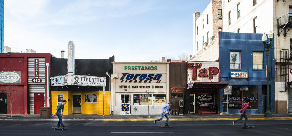 UNITED STATES - FEBRUARY 22: Skateboarders zip past a colorful row of small businesses in downtown El Paso, Texas (Photo by Carol M. Highsmith/Buyenlarge/Getty Images) (Photo: Buyenlarge via Getty Images)