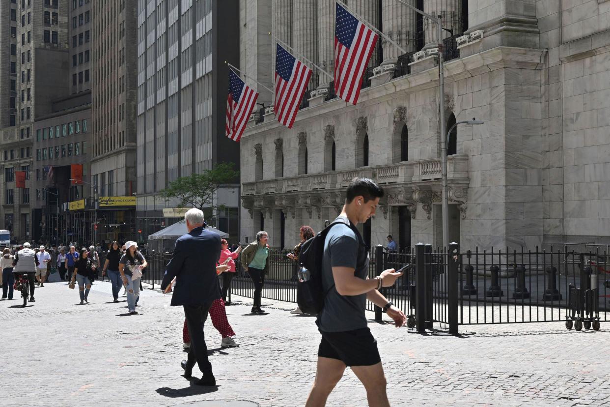 Atmosphere in and around Wall Street and The New York Stock Exchange. FTSE was lower on Thursday