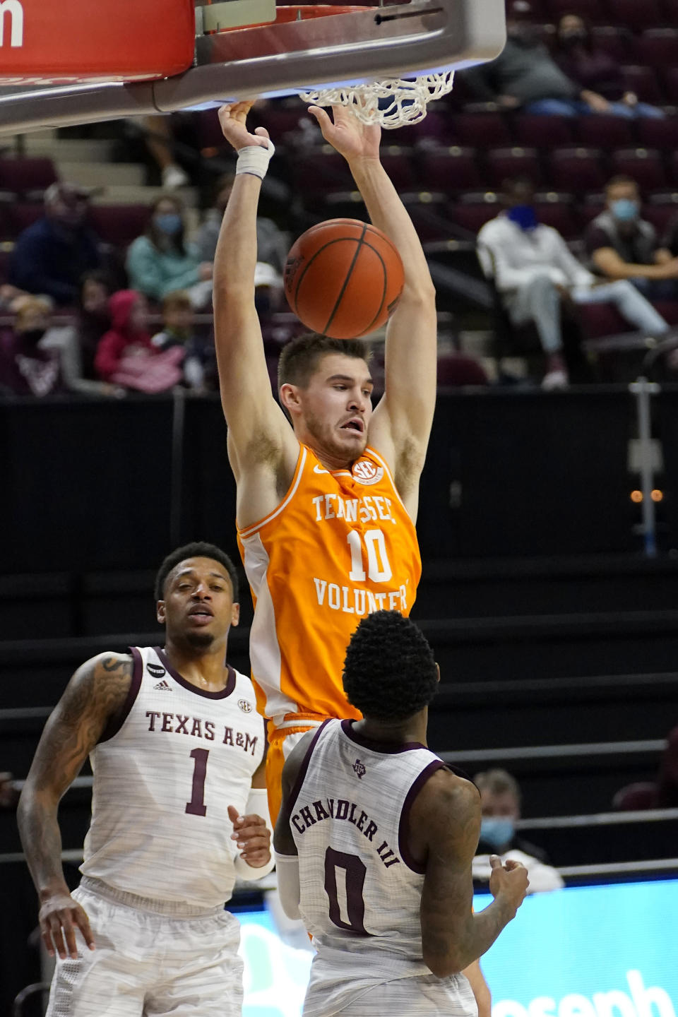 Tennessee forward John Fulkerson (10) dunks the ball over Texas A&M guard Jay Jay Chandler (0) during the first half of an NCAA college basketball game Saturday, Jan. 9, 2021, in College Station, Texas. (AP Photo/Sam Craft)