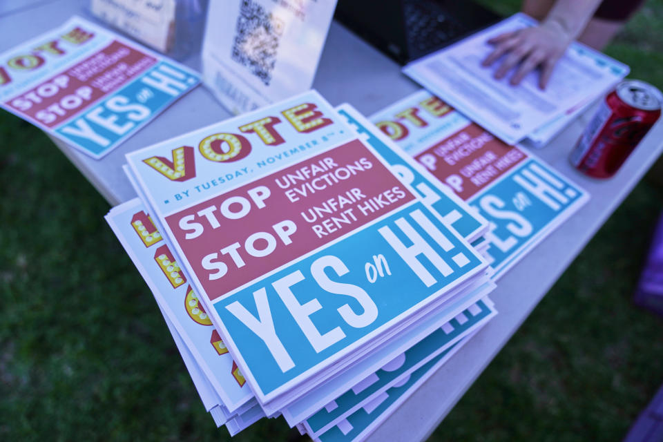 FILE - Flyers for the Yes on Measure H! campaign to cap rent increases and evictions are distributed at La Pintoresca Park in Pasadena, Calif., on Oct. 29, 2022. Ballot measures to build more affordable housing and protect tenants from soaring rent increases were plentiful and fared well in last week's midterm elections. The activity reflected growing angst over record high rents exacerbated by inflation and a dearth of homes. (AP Photo/Damian Dovarganes, File)