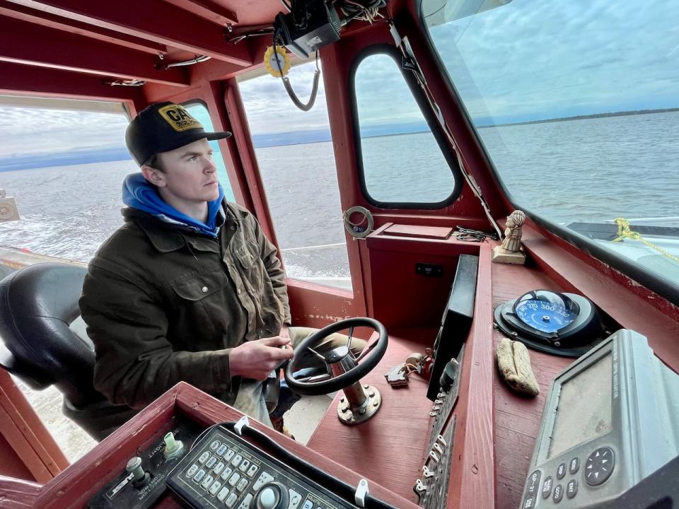 Liam MacEachern navigates the waters of Tabusintac Bay in his lobster boat, tracking the depths of the harbour on a marine depth sounder.