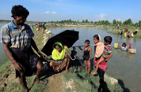 A Rohingya refugees who fled from Myanmar rest as they make their way after crossing the border in Palang Khali, near Cox's Bazar, Bangladesh October 16, 2017. REUTERS/Zohra Bensemra