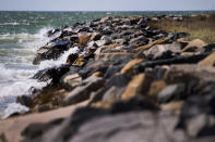 <p>The water of the Chesapeake Bay crashes against the man-made sea wall that was engineered by the Army Corps of Engineers in 1999 to prevent erosion in Tangier, Virginia, May 15, 2017, where climate change and rising sea levels threaten the inhabitants of the slowly sinking island.<br> (Jim Watson/AFP/Getty Images) </p>