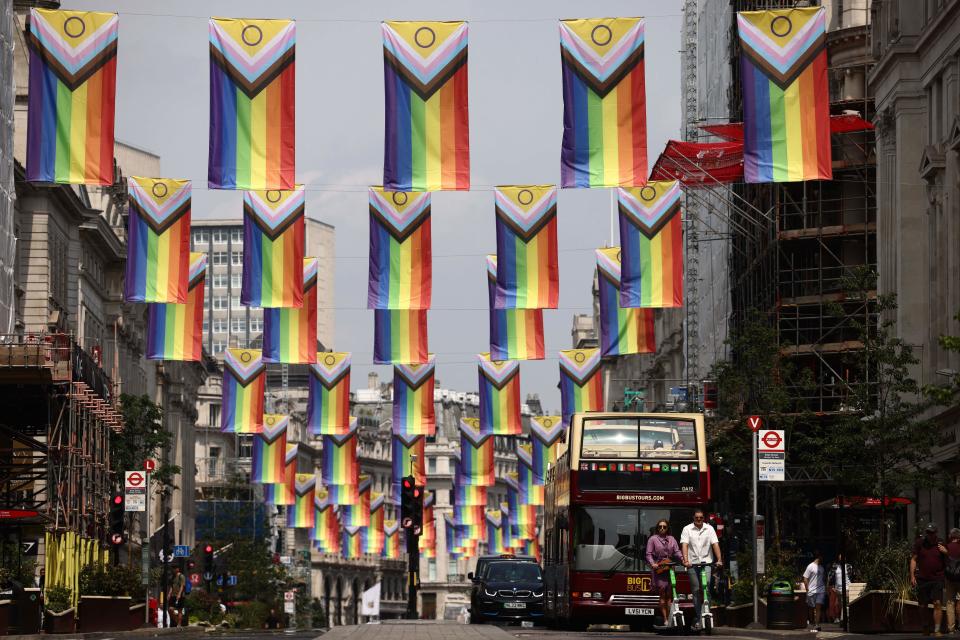 TOPSHOT - The LGBTQIA2-S flags of the Lesbian, Gay, Bisexual and Transgender (LGBT+) community hang high on Regent Street in London on June 18, 2023. (Photo by HENRY NICHOLLS / AFP) (Photo by HENRY NICHOLLS/AFP via Getty Images)