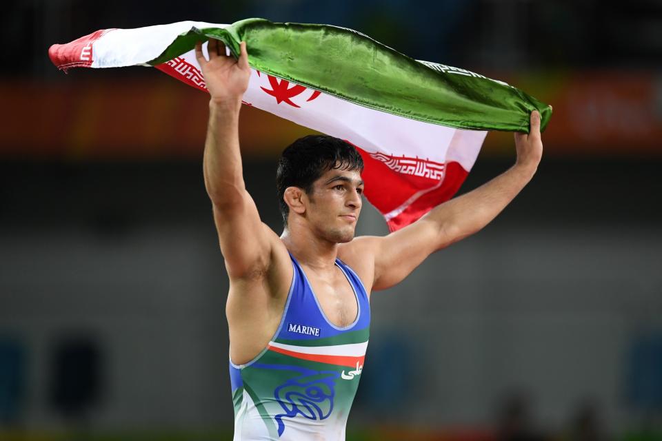 <p>Hassan Aliazam Yazdanicharati of the Islamic Republic of Iran celebrates after defeating Aniuar Geduev of Russia during the Men’s 74kg Gold Medal Wrestling match on Day 14 of the Rio 2016 Olympic Games at Carioca Arena 2 on August 19, 2016 in Rio de Janeiro, Brazil. (Photo by Matthias Hangst/Getty Images) </p>