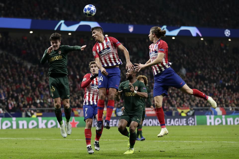 Atletico midfielder Rodrigo Hernandez, center, heads the ball during a Group A Champions League soccer match between Atletico Madrid and Monaco at the Metropolitano stadium in Madrid, Wednesday, Nov. 28, 2018. (AP Photo/Manu Fernandez)