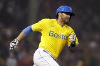 Boston Red Sox's J.D. Martinez nears first on his RBI double during the fifth inning of the team's baseball game against the Baltimore Orioles, Friday, Sept. 17, 2021, in Boston. (AP Photo/Michael Dwyer)