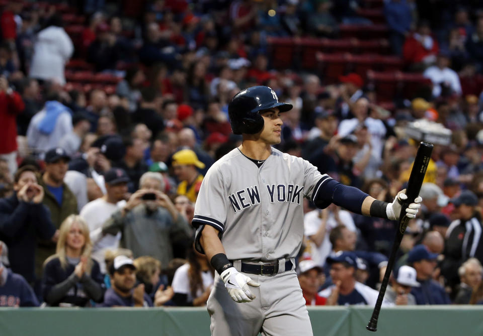 New York Yankees' Jacoby Ellsbury is booed by fans as he walks to the plate for his first at-bat during the first inning of a baseball game at Fenway Park in Boston, Tuesday, April 22, 2014. (AP Photo/Elise Amendola)