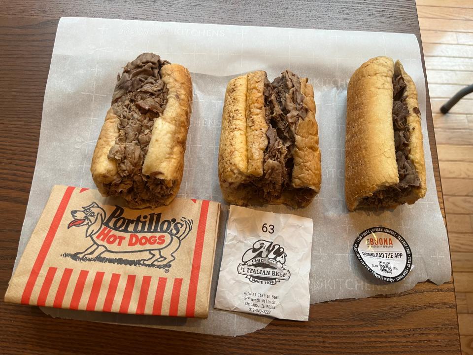 Three Italian beef sandwiches side by side.