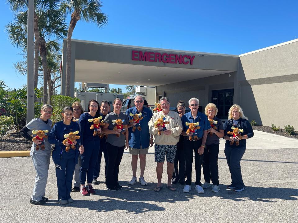 Members of the staff at Englewood Hospital hold the Tommy the Moose dolls donated by Englewood Moose Lodge 1933. The Moose give more than 600 dolls to the hospital every year to comfort patients.
