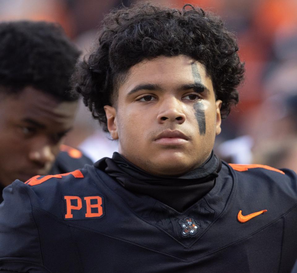 Massillon quarterback DaOne Owens stands with his teammates during the national anthem before playing St. John's (D.C.), Friday Sept. 29, 2023.