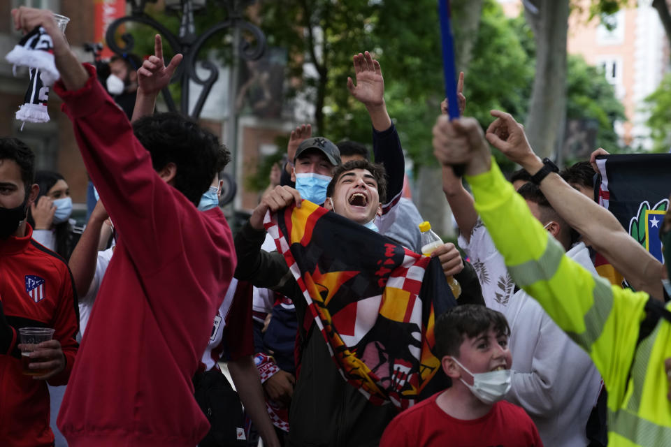 Atletico Madrid supporters celebrate their team's Spanish La Liga title in Madrid, Saturday, May 22, 2021. Atletico clinches its 11th Spanish La Liga title. (AP Photo/Paul White)