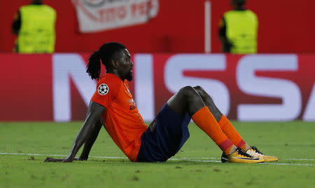 Soccer Football - Champions League Playoffs - Sevilla v Istanbul Basakshehir - Seville, Spain - August 22, 2017 Istanbul Basaksehir’s Emmanuel Adebayor looks dejected at the end of the match REUTERS/Jon Nazca