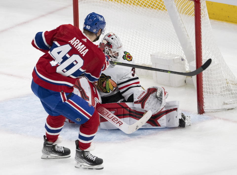 Montreal Canadiens right wing Joel Armia (40) is stopped by Chicago Blackhawks goaltender Jaxson Stauber (30) during the second period of an NHL hockey game Tuesday, Feb. 14, 2023 in Montreal. (Ryan Remiorz/The Canadian Press via AP)