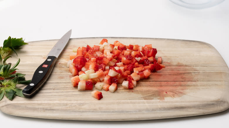 diced strawberries on cutting board 