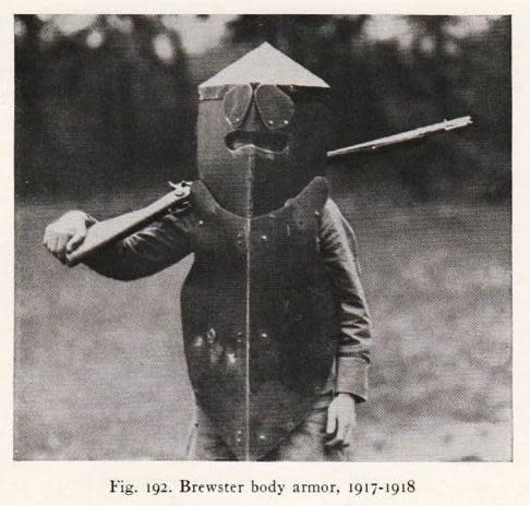 "Brewster body armor, 1917-1918," looking clumsy and heavy, with a boxy helmet that covers the entire head and extends into a chest shield
