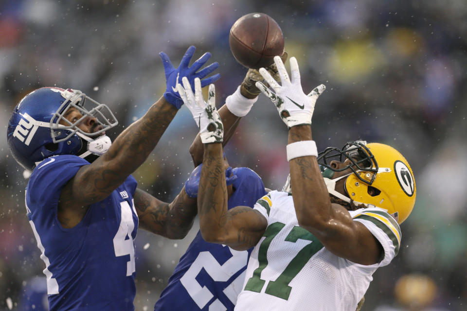 New York Giants' Antoine Bethea, left breaks up a pass intended for Green Bay Packers' Davante Adams during the first half of an NFL football game, Sunday, Dec. 1, 2019, in East Rutherford, N.J. (AP Photo/Adam Hunger)