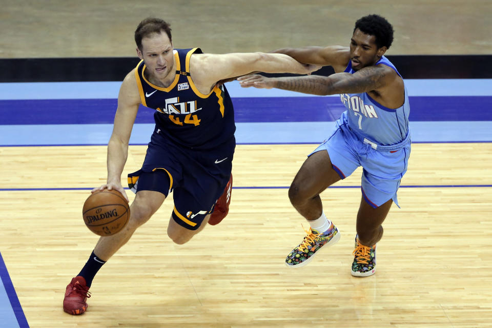 Utah Jazz forward Bojan Bogdanovic (44) drives around Houston Rockets guard Armoni Brooks (7) during the second half of an NBA basketball game Wednesday, April 21, 2021, in Houston. (AP Photo/Michael Wyke, Pool)