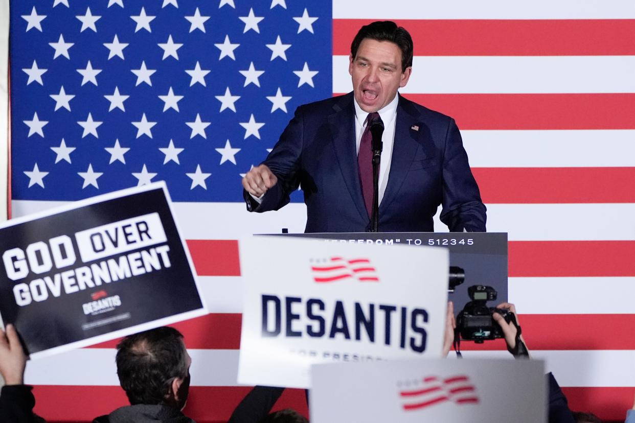 Then-Republican presidential candidate Ron DeSantis speaks to supporters at a caucus night party in West Des Moines, Iowa, on 15 January (AP)