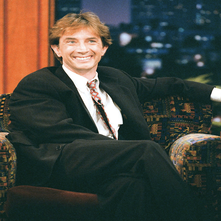 Close-up of Martin on a talk show smiling
