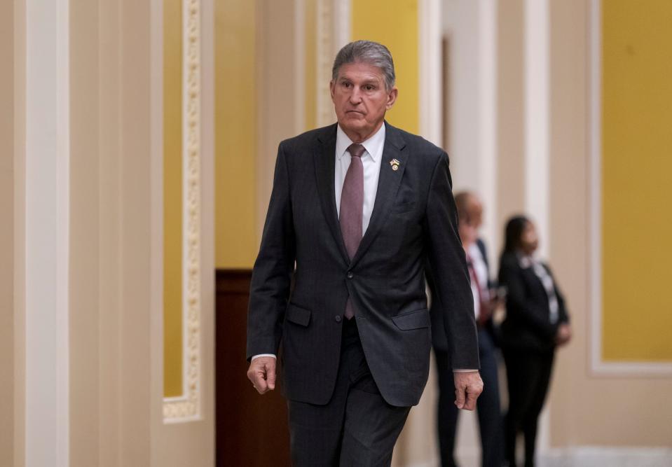 Sen. Joe Manchin, D-W.Va., heads to the chamber for a vote during a lunch with Senate Democrats and President Joe Biden, at the Capitol in Washington, Thursday, March 2, 2023. He said he will vote with Republicans and other Democrats to block criminal code reform passed by the D.C. city council.