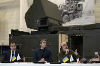 Ukrainian Minister of Defense Oleksii Reznikov, right, delivers his statement after signing an agreement with French Defense Minister Sebastien Lecornu, left, and Chairman and CEO of Thales Group Patrice Caine, center, during a visit at Thales radar factory in Limours, south west of Paris, France, Wednesday, Feb. 1, 2023. France has guaranteed Kyiv the delivery of a Ground Master 200 (GM200) radar, produced by the French manufacturer Thales. This medium-range radar is capable of spotting enemy aircraft at 250 km and engaging them at 100 km, whether they are flying at low speed and low altitude like drones or at high altitude like fighter planes. (AP Photo/Christophe Ena)