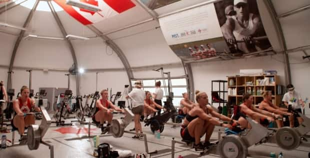 In order to prepare for the extreme heat expected in Tokyo, the Canadian women's eight rowing team has been training in an 'erg dome' in Victoria, B.C., that's heated to 35 C. (Dan Batchelor - image credit)