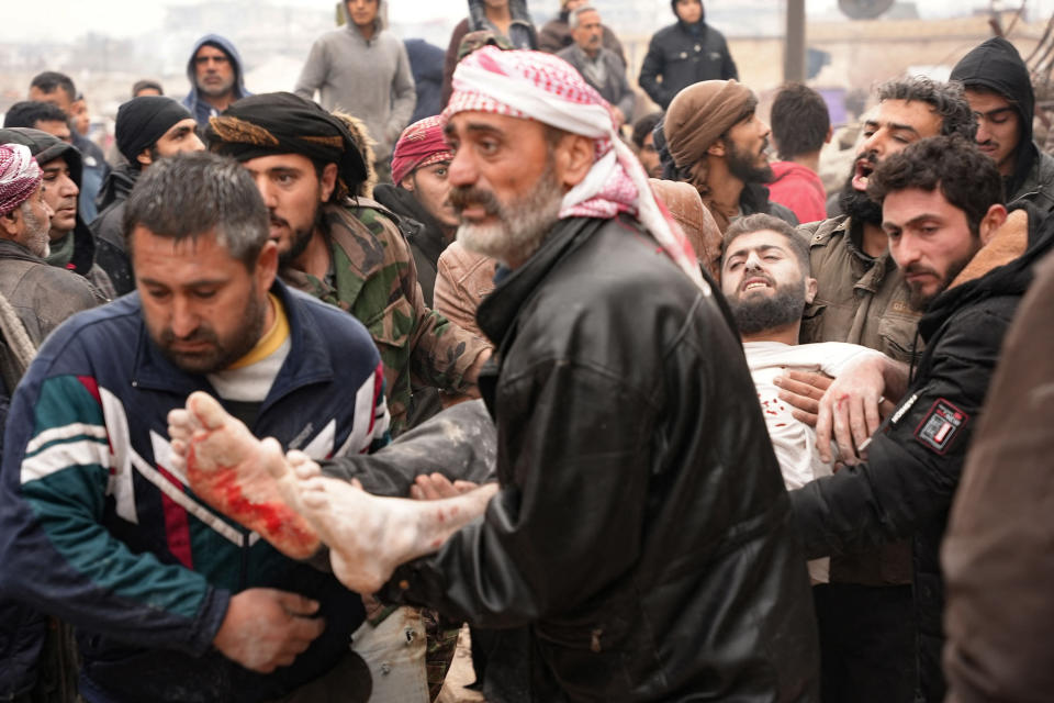 Residents retrieve an injured man from the rubble in Jandaris, Syria. (Rami Al Sayed / AFP - Getty Images)