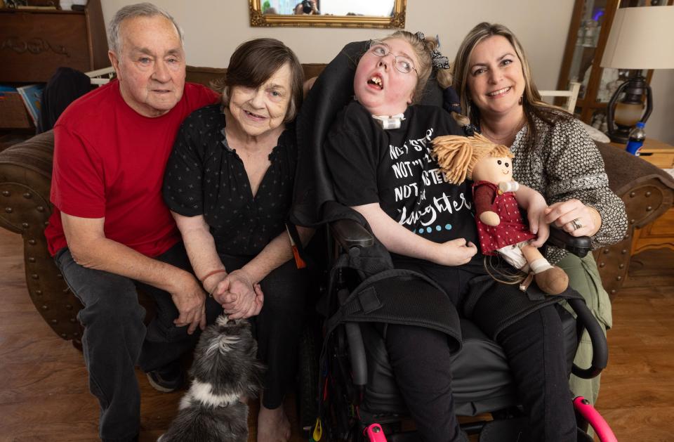 Marvin and Lori Penrod, left, Marissa Anderegg, and Stephanie Snee pose for a photo at the Penrods' Jackson Township home.