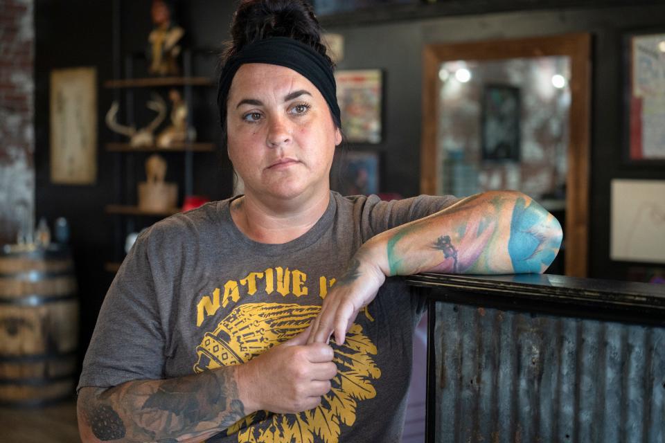 Tattoo Artist Brandee Gordon talks of the town of Elwood mourning the death of Elwood Police Officer Noah Shahnavaz, Monday, Aug. 1, 2022 in Elwood, Ind. Officer Shahnavaz was killed early Sunday morning, July 31, 2022, during a traffic stop in Madison County. 
