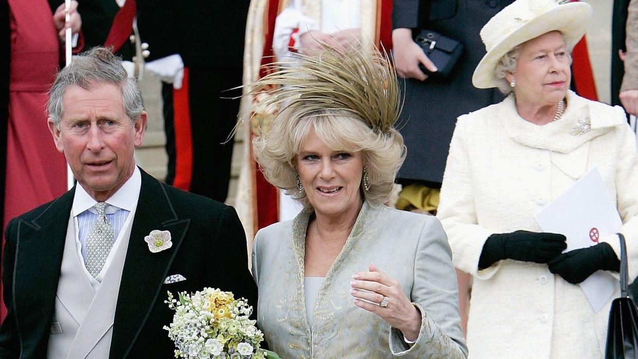 Prince Charles and Camilla Parker Bowles walk ahead of Queen Elizabeth II on their wedding day