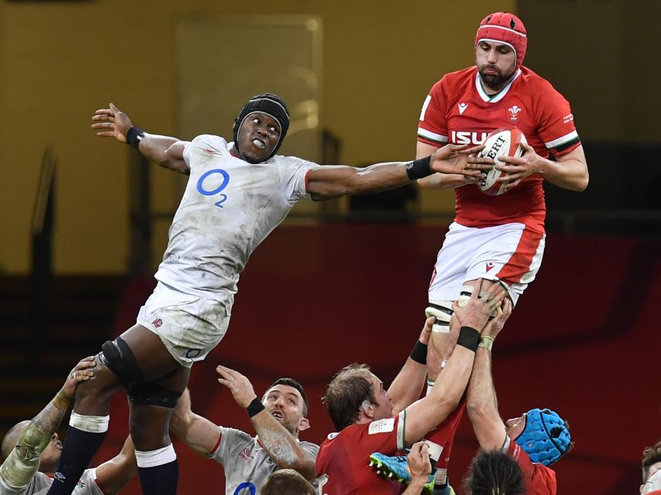 Wales’ Cory Hill wins the ball from England lock Maro Itoje in the line-out (AFP via Getty Images)