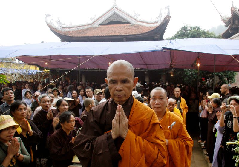 FILE PHOTO: Buddhist monk Nhat Hanh walks among believers at a requiem mass at the Non Nuoc pagoda outside Hanoi