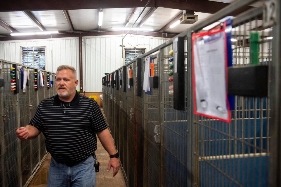 Executive director Steve Tears walks through kennels at the Montgomery Humane Society in Montgomery, Ala., on Friday, July 23, 2021.