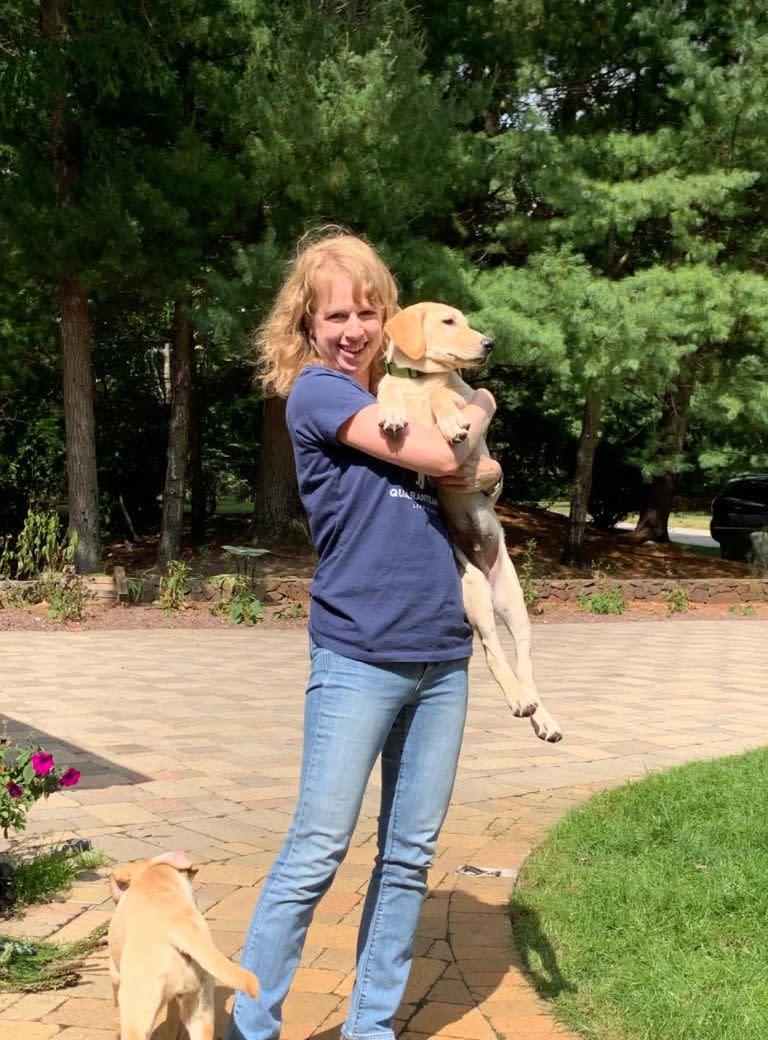 The author, picking up Beau, then three-and-a-half months old, at his foster home last September. (Photo: Courtesy of Tracy Strauss)