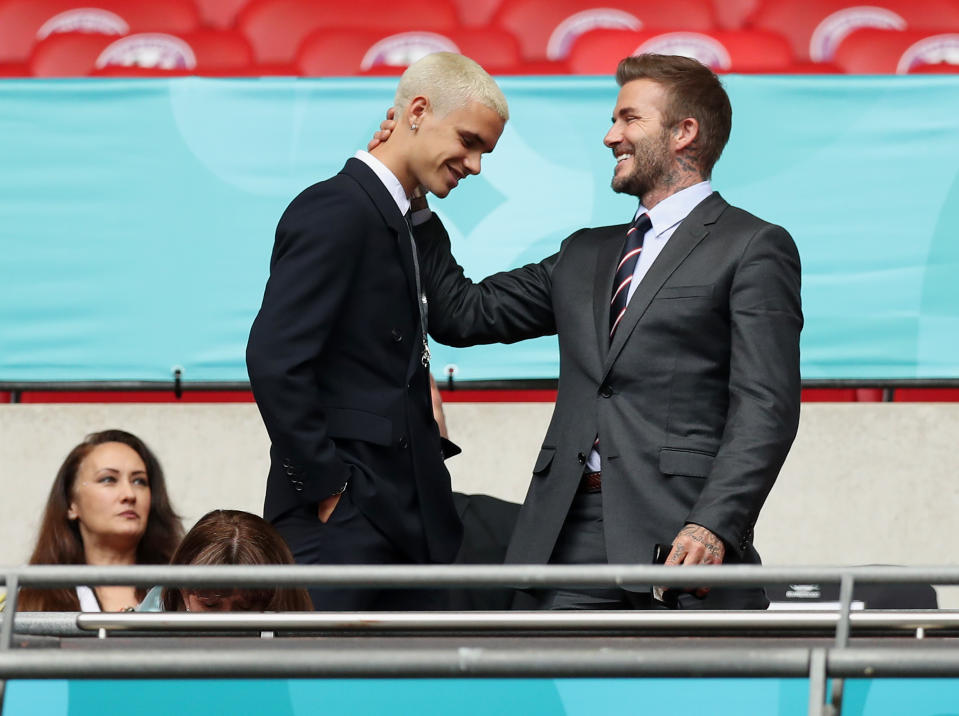 LONDON, ENGLAND - JUNE 29: Romeo James Beckham and his father, David Beckham react during the UEFA Euro 2020 Championship Round of 16 match between England and Germany at Wembley Stadium on June 29, 2021 in London, England. (Photo by Alex Morton - UEFA/UEFA via Getty Images)