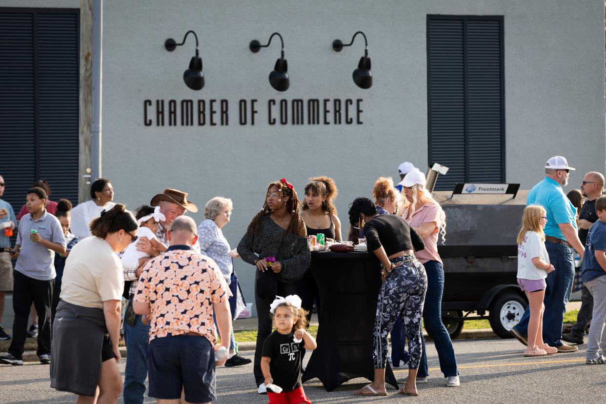 T-Rex relay races, music and free food where highlights of the annual Bay County Chamber of Commerce block party held in downtown Panama City Thursday.