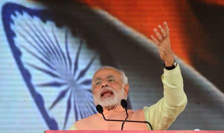 Gujarat's chief minister and Hindu nationalist Narendra Modi, the prime ministerial candidate for main opposition Bharatiya Janata Party (BJP) addresses a rally in Patna October 27, 2013. REUTERS/Krishna Murari Kishan/Files