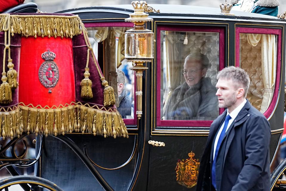 Queen Margrethe II rides in a carriage after abdicating the throne to her son.