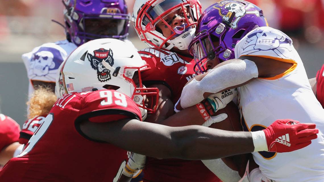 A 2019 photo shows N.C. State’s Joseph Boletepeli (99) in action against ECU.