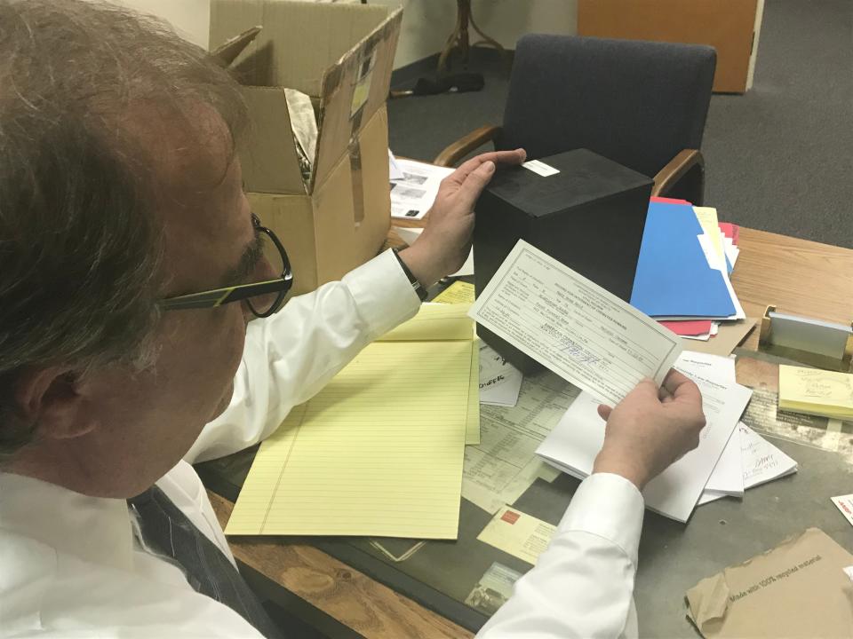 Ron Elgart, an attorney in his Falls Township office where he has kept the cremated remains of a former client for nearly 20 years, after they were returned by a family member. (Photo: JO CIAVAGLIA/STAFF PHOTO JOURNALIST)